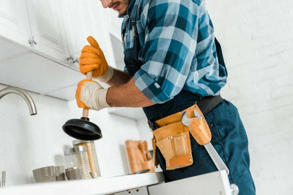 Cropped-View-Of-Handyman-With-Tool-Belt-Holding-Pl-Laawxc8.Jpg